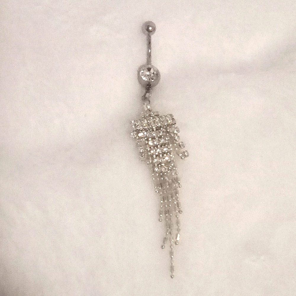 2 silver belly button piercings and 1 gold belly button piercing